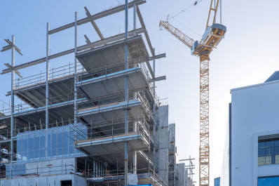 Image of a crane next to a building under construction