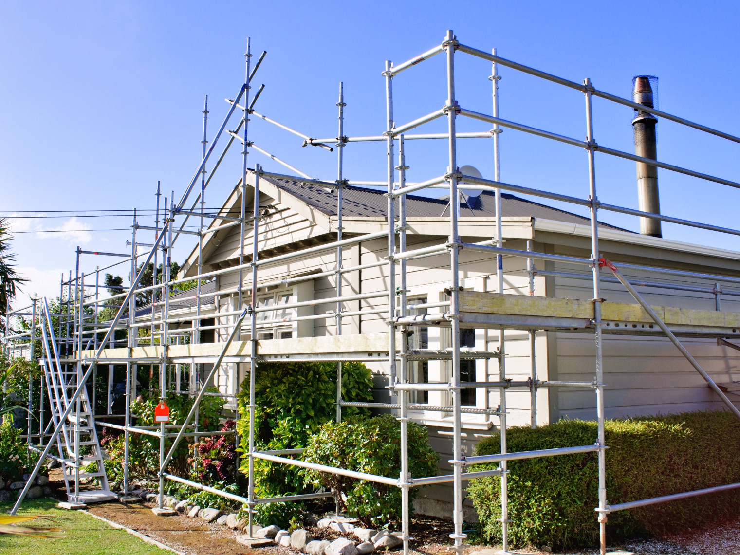 House surrounded by scaffolding