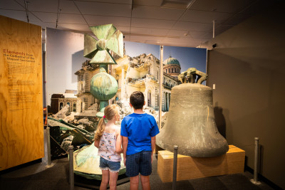 Two kids looking at a Quake City exhibit