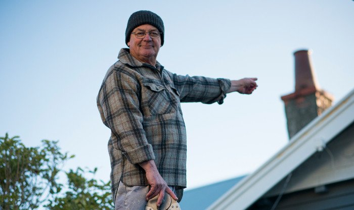 Man pointing to a chimney